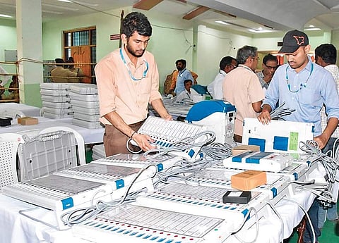 Poll officials checking the EVMs for LS elections in Nizamabad on Wednesday | Express