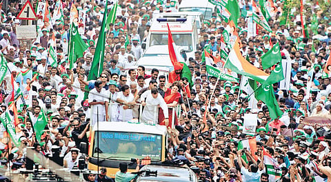 AICC president Rahul Gandhi and general secretary Priyanka Gandhi Vadra greeting party workers during the  road show at Kalpetta after Rahul Gandhi filed his nomination papers in Wayanad on Thursday | A Sanesh