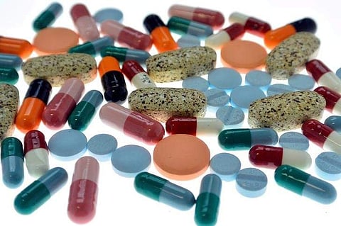 Pharmaceutical tablets and capsules are arranged on a table in a photo illustration. (File Photo | Reuters)