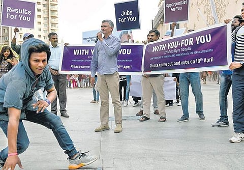 Supporters of Bangalore North candidate Krishna Byre Gowda break into a flash mob as a part of his campaign at Orion Mall in Bengaluru on Sunday | Nagaraja Gadekal