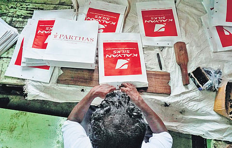 Jail inmate making a paper bag Nandakumar H V