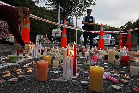 A file photo of a student lights candle during a vigil to commemorate victims of March 15 shooting, outside the Al Noor mosque in Christchurch, New Zealand. (Photo | AP)
