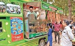 People enjoying the jackfruit products sold in front of Press Club as part of the inauguration of 'Chakka Vandi' (Photo | BP Deepu/EPS)