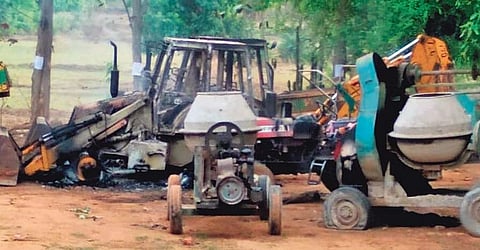 Vehicles and construction equipment that were set afire by Maoists in Nuamunda village on Tuesday night | Express