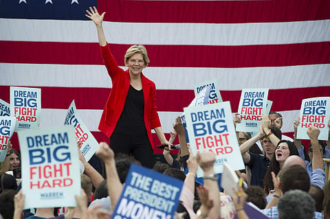 Democratic presidential candidate Sen. Elizabeth Warren, D-Mass., addresses a campaign rally at George Mason University in Fairfax, Va. Warren is gaining traction with black women debating which Democratic presidential candidate to back in a historically 