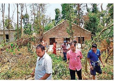 Officials inspecting a poultry farm at Gamhapur village | Express