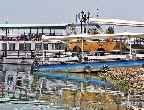 A Tourism department’s boat on the river-bed at Punnami Ghat | P Ravindra Babu