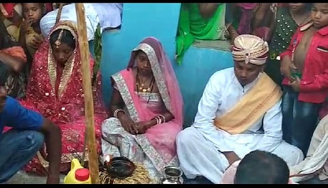 Anil Paikra sitting in the wedding mandap with his wife and lover  Baghdol gram panchayat in Jashpur district of Chhattisgarh. (Photo | EPS)