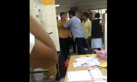 One of the men was seen arguing with the doctor, threatening him and using foul language even as two policemen present at the scene were trying to pacify him. (Photo | Twitter Screengrab))