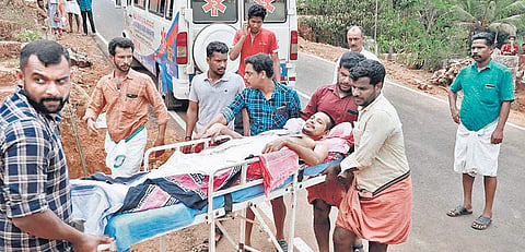 A Madhu, 39, an autorickshaw driver from Cheemeni, being carried on a stretcher into booth No.48 at Government High School, Kooliyad, to cast his vote on Sunday. He is paralysed waist down after meeting with an accident a month ago. Madhu, who was in hosp