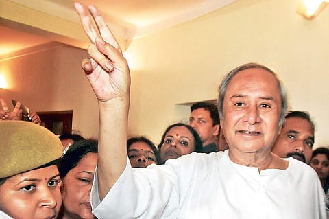 Chief Minister and BJD president Naveen Patnaik shows victory sign at Naveen Niwas in Bhubaneswar on Thursday | Express