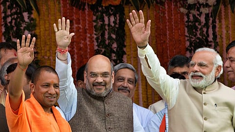 (L-R) Uttar Pradesh Chief Minister Yogi Adityanath, Union Home Minister Amit Shah and Prime Minister Narendra Modi.