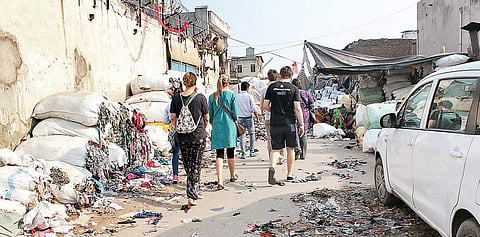 Understanding India Tours will host a Slum Tour at Sanjay Colony on May 26, part of I AM - Identity Art Marathon. (Clockwise) Pictures from their earlier walks in the area.