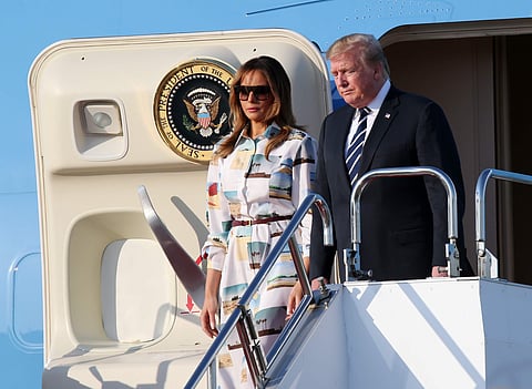 U.S. President Donald Trump, right, and first lady Melania Trump arrive at the Haneda International Airport Saturday, May 25, 2019, in Tokyo. (Photo | AP)