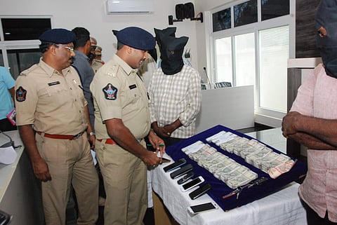 Mangalagiri police with seized cash  and mobile phones | Express