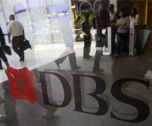 People walk in the lobby of a DBS Bank building in Singapore (File photo | Reuters)