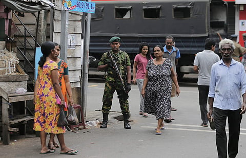 A Sri Lankan police commando secures the area of exploded St. Anthony's Church on Easter Sunday attacks in Colombo (Photo| AP)