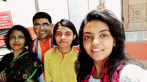 Varuni Vats (in yellow dress) along with her parents. (Photo | ENS)