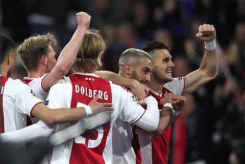 Ajax's Hakim Ziyech celebrates with Dusan Tadic, right,after scoring his side's second goal during the Champions League semifinal second leg soccer match between Ajax and Tottenham Hotspur at the Johan Cruyff ArenA in Amsterdam, Netherlands, Wednesday, Ma