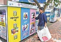 A city resident dropping  cloth waste at the newly set up dry waste segregated collection hub B P Deepu
