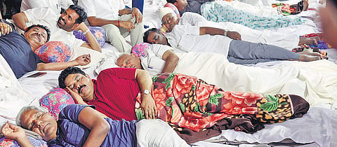 BJP State president B S Yeddyurappa settles down for the night in front of the Gandhi Statue on Race Course Road. Several BJP leaders including R Ashoka, Somashekara Reddy and others participated in the day and night protest against the State government’s