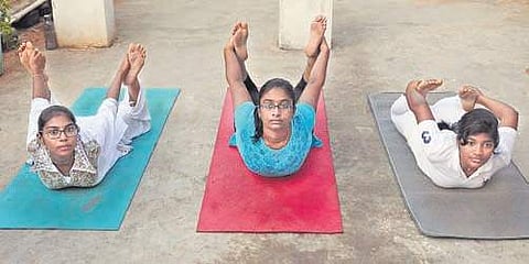 Children performs yogasanas at the Jeevan Yoga Centre. (Photo | Prasant Madugula/EPS)