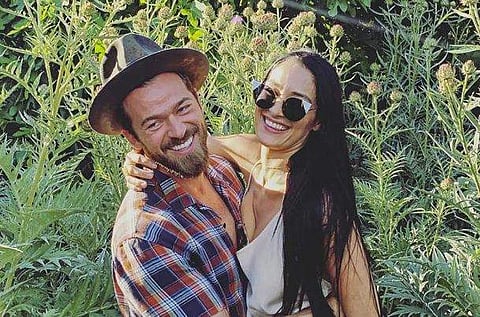 Artem Chigvintsev (L) and Nikki Bella.