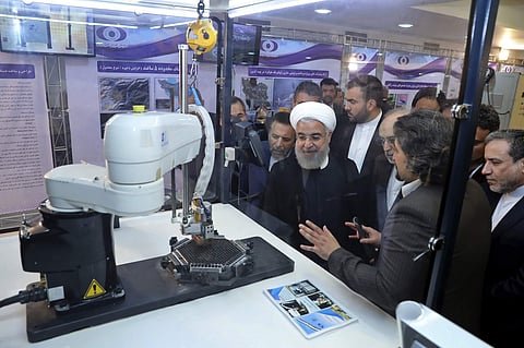 Iran President Hassan Rouhani listens to explanations on new nuclear achievements at a ceremony to mark 'National Nuclear Day,' in Tehran, Iran (File Photo | AP)