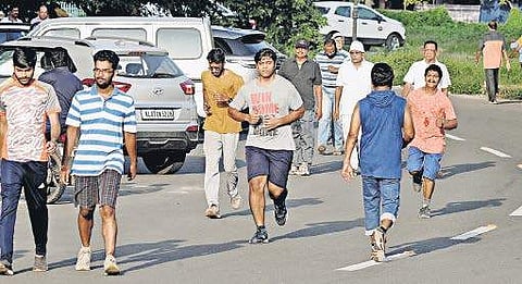 Joggers taking to the road around the  Jawaharlal NehruStadium at Kaloor A Sanesh