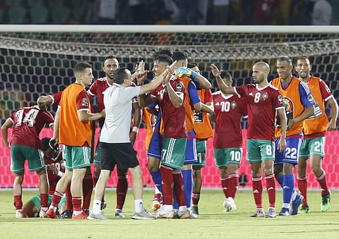 Moroccan players celebrate after defeating Ivory Coast in the African Cup of Nations. (Photo | AP)