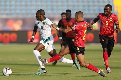 Mauritania's forward Adama Ba (L) is fouled by Angola's defender Bruno Gaspar | AFP