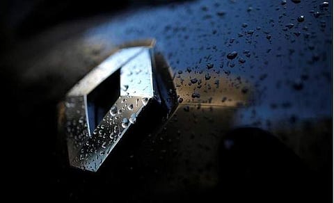 Raindrops cover the logo of French car manufacturer Renault on a automobile seen in Paris (File| Reuters)