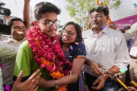 NEET 2019 topper Nalin Khandelwal from Rajasthan with his parents on 5 June 2019. (Photo | PTI)