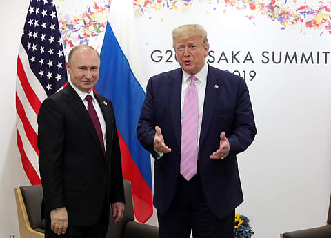 U.S. President Donald Trump, right, and Russian President Vladimir Putin pose for a photo during a bilateral meeting on the sidelines of the G-20 summit in Osaka, Japan. ( Photo | AP)