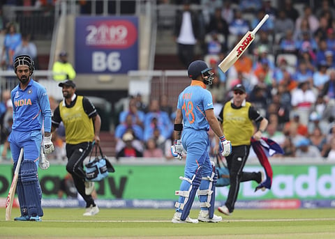 India's captain Virat Kohli throws his bat in the air after being dismissed during the Cricket World Cup semifinal match between India and New Zealand at Old Trafford in Manchester (Photo | AP)