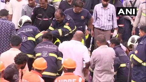 Rescue operations in Malad East where 19 people died after a wall collapsed on hutments in Pimpripada area, due to heavy rainfall. (Photo | ANI, Twitter)