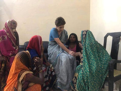Congress General Secretary Priyanka Gandhi Vadra consoles a family member of a Sonbhadra massacre victim who had travelled to Chunar Fort to meet her after the former was stopped from proceeding to Sonbhadra in Mirzapur on 20 July 2019. (Photo |  AICC)