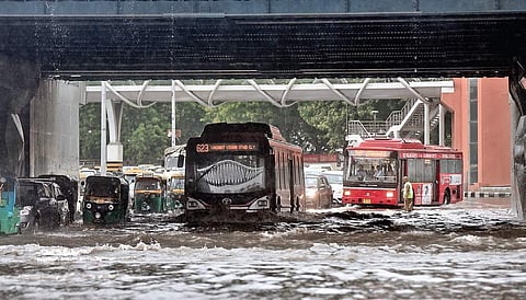 Vehicles move on a waterlogged road underneath the rail bridge at ITO on Sunday after rains lashed Delhi (File| EPS/ Parveen Negi)
