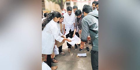 Doctors stage a protest by burning copies of NMC Bill. (Photo | EPS)
