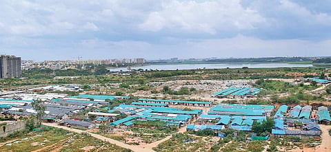 Bellandur residents allege illegal slums in the private land next to the lake have increased two-fold in past two months | Pandarinath B