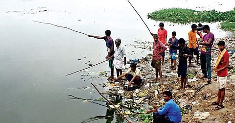 Locals fishing at Velachery Lake. (File Photo | EPS)