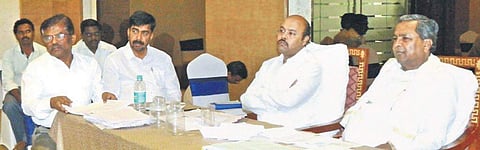 Former Chief Minister Siddaramaiah addresses a booth-level meeting with party workers in Varuna, his son Yathindra’s constituency  | Express