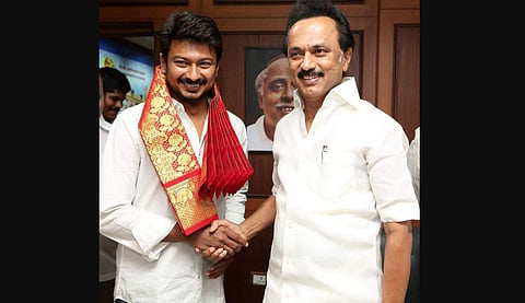 DMK President MK Stalin presents a shawl to his son Udayanidhi Stalin to mark the appointment of the latter as party youth wing Secretary at Anna Arivalayam on 5 July 2019 in Chennai. (Photo | EPS)