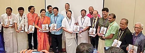 Minister K Pandiarajan releasing the book Sootti Magizhvom Thamizh Peyargal at the 10th World Tamil Conference in Chicago, United States, on Friday (Photo | EPS)