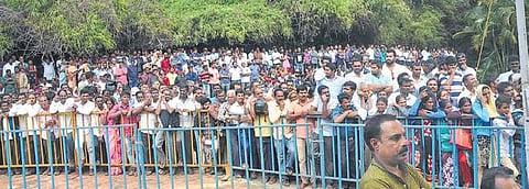 People gather during the funeral of the coffee tycoon |express