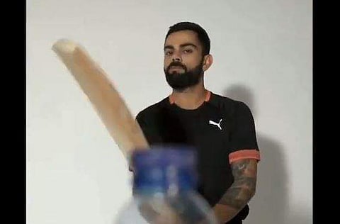 India skipper Virat Kohli has become the latest celebrity to take up the famous bottle cap challenge. (Photo | Screenshot)