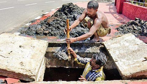 Workers cleaning a sewer at Thampanoor. Cases of suspected leptospirosis are more common among those who engage in scavenging, cleaning and agriculture activities  B P Deepu