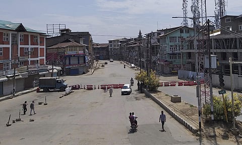 Pedestrians move on a deserted street in Srinagar on Thursday 8th August 2019 (File Photo | AP)