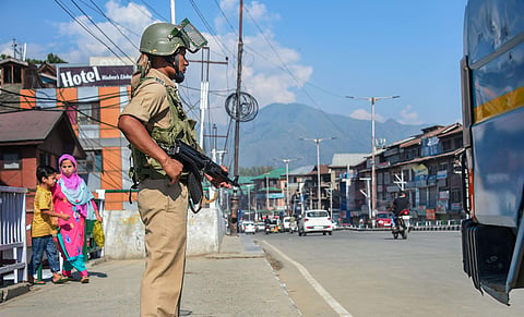 A CRPF jawan stands guard in Kashmir. (File Photo | PTI)