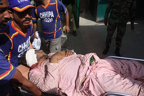 Pakistan I volunteers run an injured person to a hospital in Quetta, Pakistan. (Photo | AP)